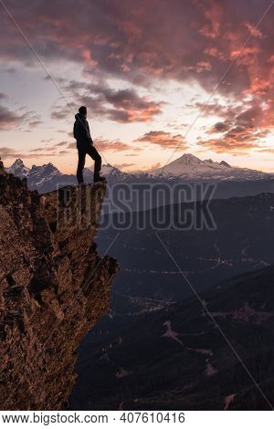 Adventurous Man Is Standing On Top Of The Mountain And Enjoying The Beautiful View. Taken On Top Of 
