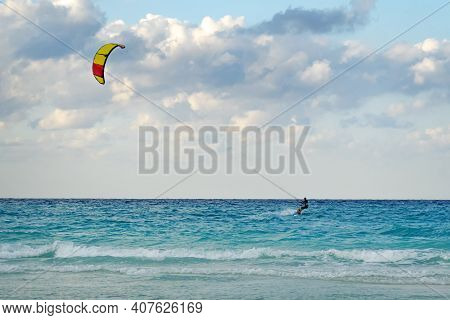 Man Is Kitesurfing In The Caribbean Sea In Varadero Cuba.