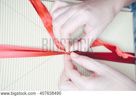 Female Hands Close-up, Holding A Gift In A Box With A Red Ribbon. Concept - Valentines Day, Womens Z