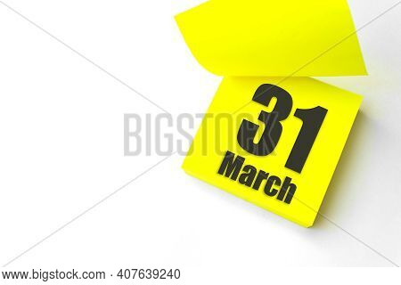 March 31st . Day 31 Of Month, Calendar Date. Close-up Blank Yellow Paper Reminder Sticky Note On Whi