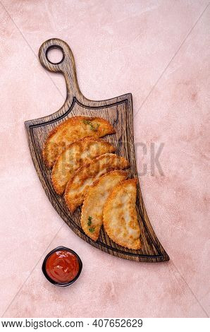 Fried Burekas With Filling On A Light Stone Background. Top View. Selective Focus.