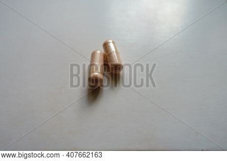 Light Pink Capsules Of Probiotic Dietary Supplement (two Items)