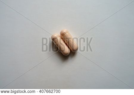 Pale Pink Capsules Of Probiotic Dietary Supplement (two Items)