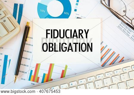 Fiduciary Obligation Is Written In A Document On The Office Desk With Office Accessories, Diagram An