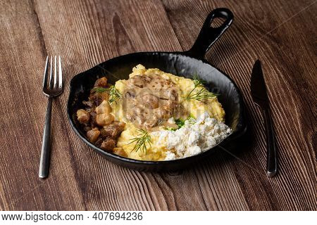 Banosh - A Traditional Dish In The Western Ukraine Made Of Cornmeal. Served In A Black Pan With Crac