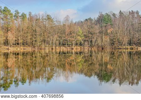 Dutch Nature Reserve In Dal Van De Roodebeek With A Lake With Mirror Reflection On The Water Surface