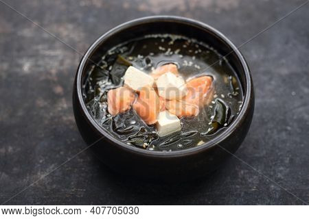 A Close-up Of A Misoshiru - Traditional Japanese Soup With Salmon.