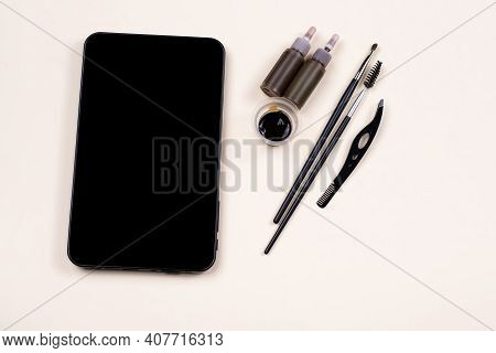 Mock Up Empty Black Tablet Screen Near A Set For Brow Hena, Tweezing Procedure. Video Tutorial, Onli