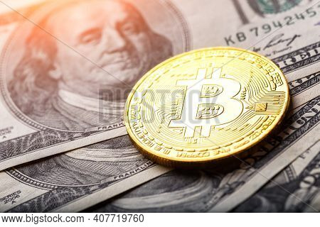 Golden Bitcoin Lies On The Banknotes.new Virtual Money. Crypto Currency Top View. Real Coins Of Bitc