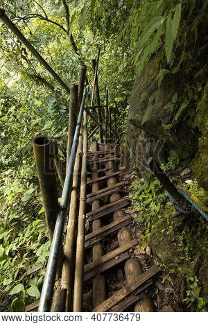 Trail With Bamboo Fences And Boards, Heading Towards The Waterfall At Tumpak Sewu Waterfall, In East