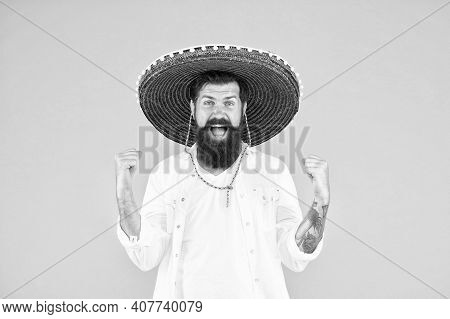 Happy Brutal Male Celebrating Fiesta. Guy Wear Poncho. Sombrero Party Man. Man In Mexican Sombrero H
