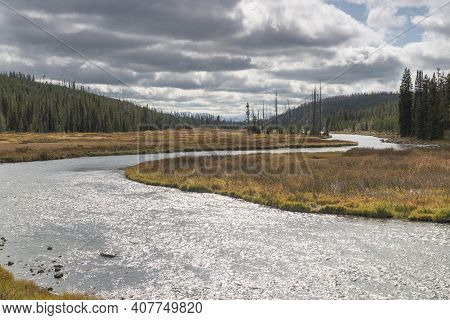Autumn View Of Sun Shining On Lewis River Of Yellowstone National Park