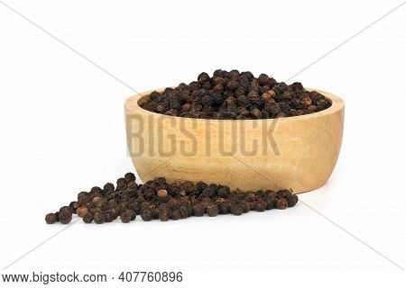 Black Pepper (black Peppercorns) In Wooden Bowl Isolated On White Background.