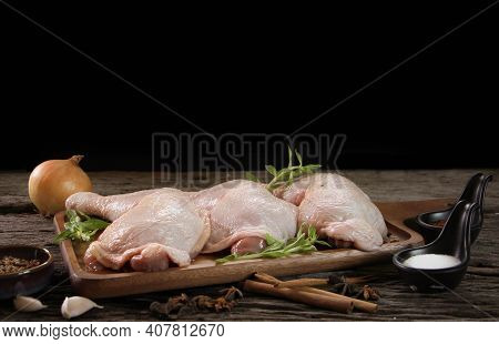 Fresh Chicken Meat With Rosemary And Spices On Wooden Board.