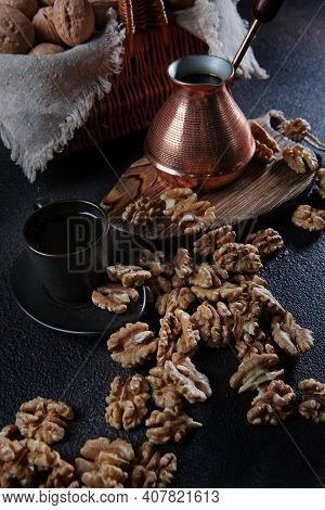 Peeled Walnuts On A Dark Background. Coffee In A Copper Turk. Kernel Of A Walnut. Natural Product. V
