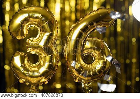 The Golden Number 36 Thirty Six Is Made From An Inflatable Balloon On A Yellow Background. One Of Th