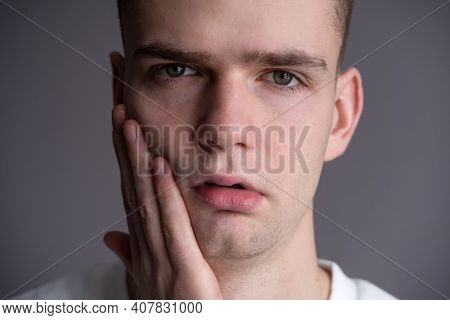 Young Sad Guy, Teenager Holding His Cheek, Toothache
