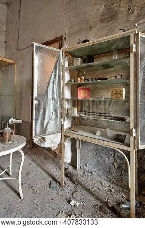 November 2020, Italy. Old Dentist\\\'s Office Of A Country Doctor, With A Dental Chair And Lockers W