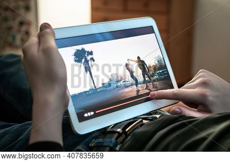 Man Watching Movie Stream. Person Using The Player Timeline To Rewind Or Skip Parts Of An Online Vid