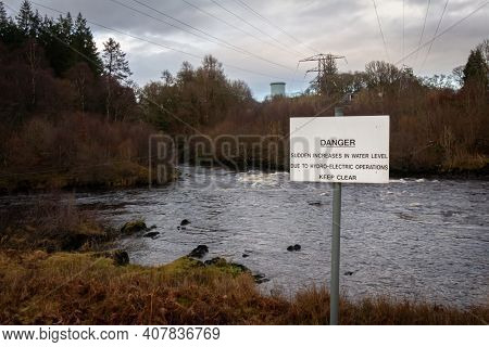 Sign Warning Of Danger Due To Sudden Increase In Water Due To Hydro Electric Operations On A River, 
