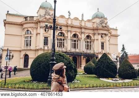 Tourist Admiring Krakow Slowackiego Theater Exterior In Poland. Architecture, Landmarks Of Krakow Ol