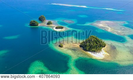 Small Island With Beautiful Beach, Palm Trees By Turquoise Water View From Above. Britania Islands, 