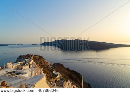 Sunset Over Oia Village Coast Line, Santorini Island, Greece, Pamorama With Aegan Sea