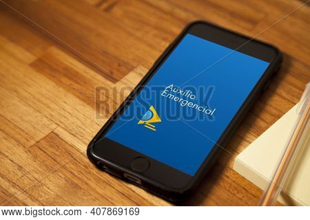 São Paulo, Brazil. Feb 12, 2021: Cell Phone With The Image Of Emergency Aid On The Wooden Table With
