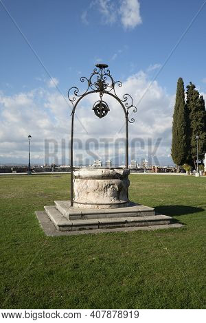 Udine, Italy. February 11, 2020. The Well In The Center Of The Meadow On The Castle Hill In The City