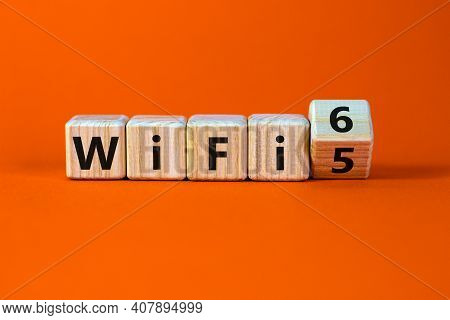 Wifi 5 Or 6 Symbol. Turned A Wooden Cube And Changed The Words Wifi 5 To Wifi 6. Beautiful Orange Ba