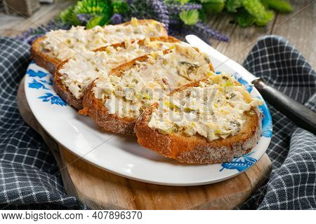 Sandwiches With A Paste Of Mackerel, Egg And Cucumber On A Wooden Table.