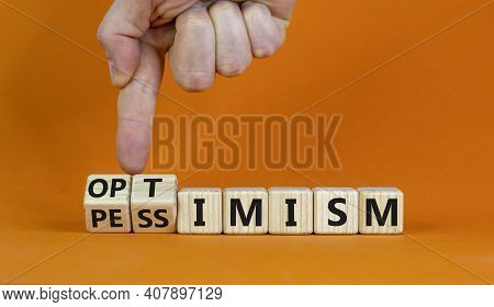 Pessimism Or Optimism Symbol. Businessman Turns Cubes And Changes The Word 'pessimism' To 'optimism'