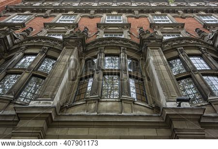 Looking Up At The Ornate Windows Of Millbank House In The City Of London, Uk