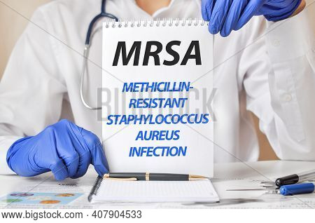 Doctor Holding A Tablet With Text: Mrsa. Mrsa Methicillin-resistant Staphylococcus Aureus Infection,