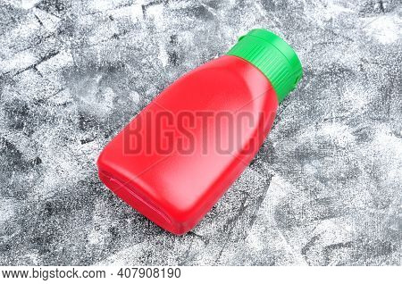 Red Food Bottle On Black And White Abstract Background