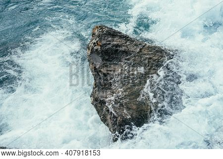 Big Stone In Azure Water Of Mountain River Close-up. Blue Nature Background With Big Boulder In Turq