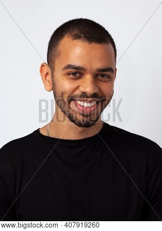 Young Simple African Guys With Sincerly Smile, In Black Sweathshot Isolated On Studio Background, Cl