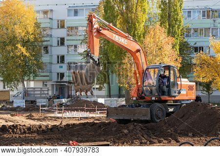Agidel, Russia - September 25, 2020 Backhoe Works In The Park. The Improvement Of The Urban Environm
