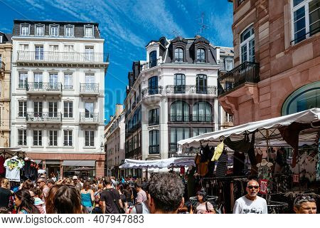 Strasbourg, France - July 29, 2017: Rear View Of Hundreds Of People Walking On The Street Of Strasbo