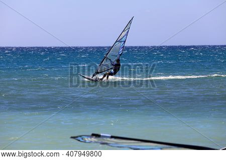 Prasonissi, Rhodes / Greece - June 23, 2014: Surfer At Cape Of Akra Prasonisi, Rhodes, Dodecanese Is
