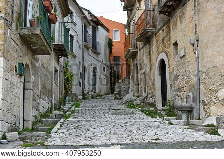 A Narrow Street Between The Old Houses Of Guardia Sanframondi, A Village In The Province Of Benevent