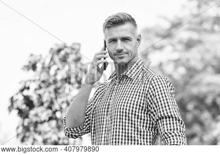 Standing By For A Call. Handsome Man Make Phone Call Outdoors. Call Answering. Incoming Call. Phone 