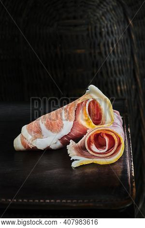 Rolled Slice Of Ham On Metal Table