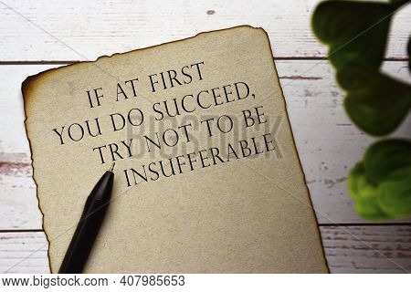 Motivational And Inspirational Quote On Burnt Edge Brown Paper With Blurred Green Plant - If At Firs