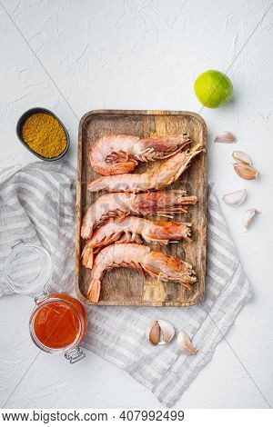 Raw King Prawns Or Shrimps Set, On Wooden Tray, On White Background, Top View Flat Lay