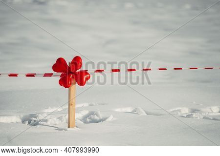 Valentine's Day. Winter Street Decor Of Four Red Heart-shaped Balloons.
