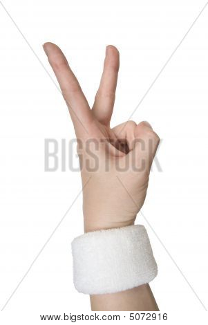 female Hand in einem weißen Wristlet Ergebnis Nummer zwei