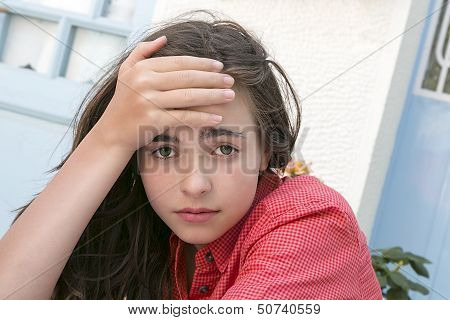 Portrait Of A Girl Holding  Here Forehead