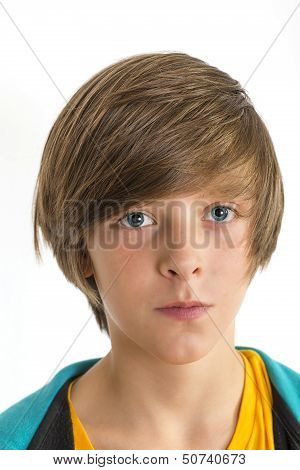 Teen Boy Smirking Into The Camera, Isolated On White