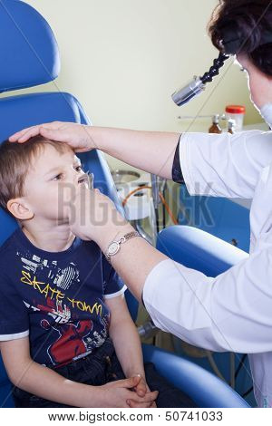 Medical Otitus Examination Of A Child At A Ear Nose Throat Doctor